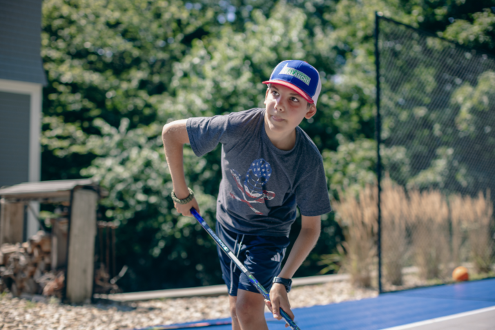 young hockey player shooting
